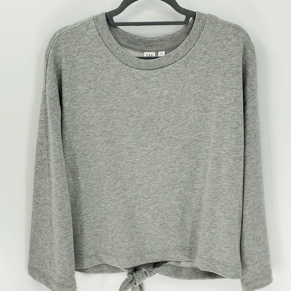 Gap NWT women's gray sweatshirt. Pull‎ over. Tie at the bottom in the bac…